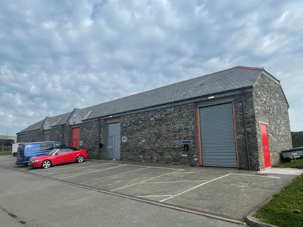Lot: 80 - FREEHOLD BUSINESS PARK FOR INVESTMENT - Exterior photo showing terrace comprising units 1, 2, 3, 4 and 5 from different angle